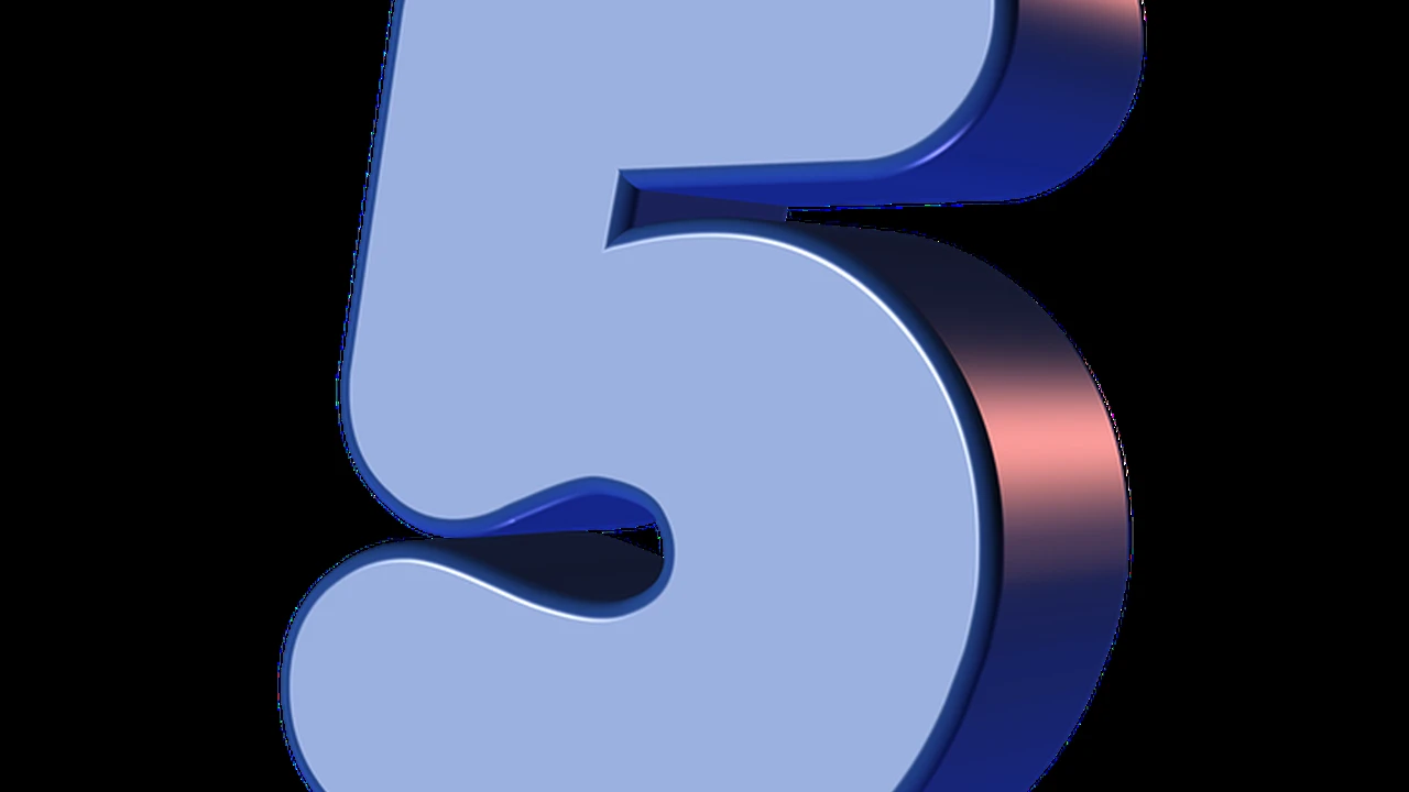 Two mint chocolate milkshakes with whipped cream and green sprinkles.