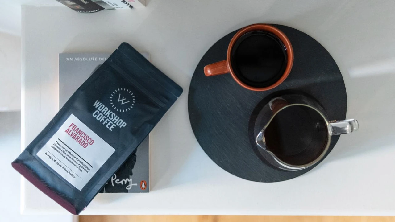 overhead view of corned beef sliced and on a platter with cabbage, potatoes, and carrots