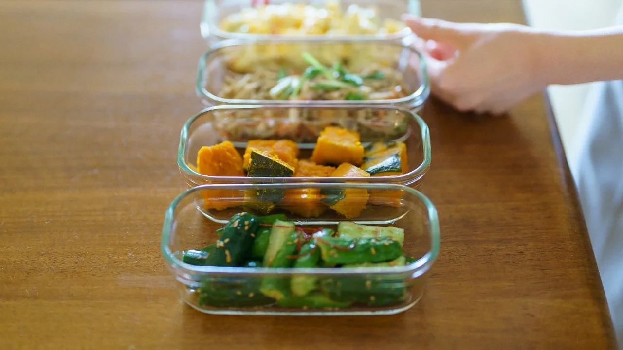 Close up on a plate of mashed potatoes, topped with baked pork chops with cream of mushroom soup, and a side of green beans.