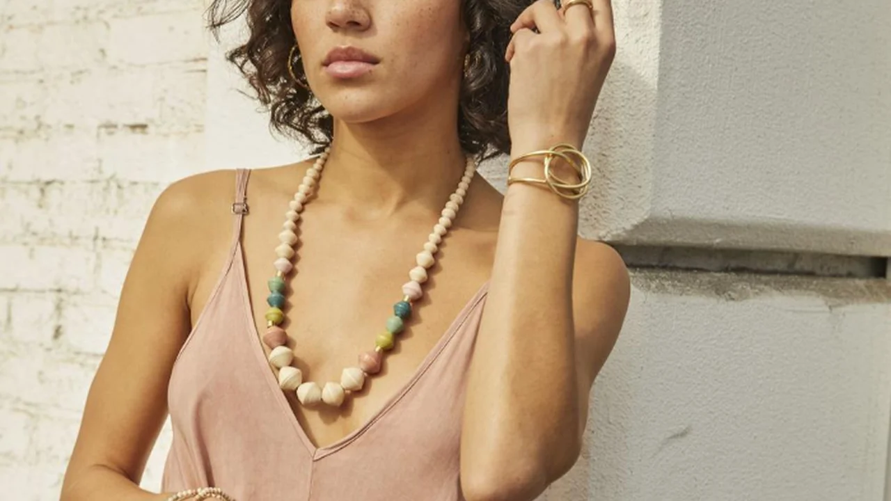 Close up on a plate of mashed potatoes, topped with baked pork chops with cream of mushroom soup, and a side of green beans.