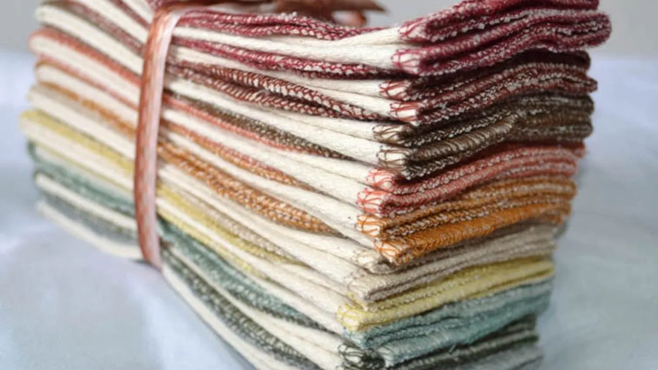 Close up on a plate of mashed potatoes, topped with baked pork chops with cream of mushroom soup, and a side of green beans.