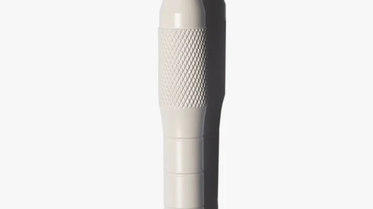 Close up on a plate of mashed potatoes, topped with baked pork chops with cream of mushroom soup, and a side of green beans.