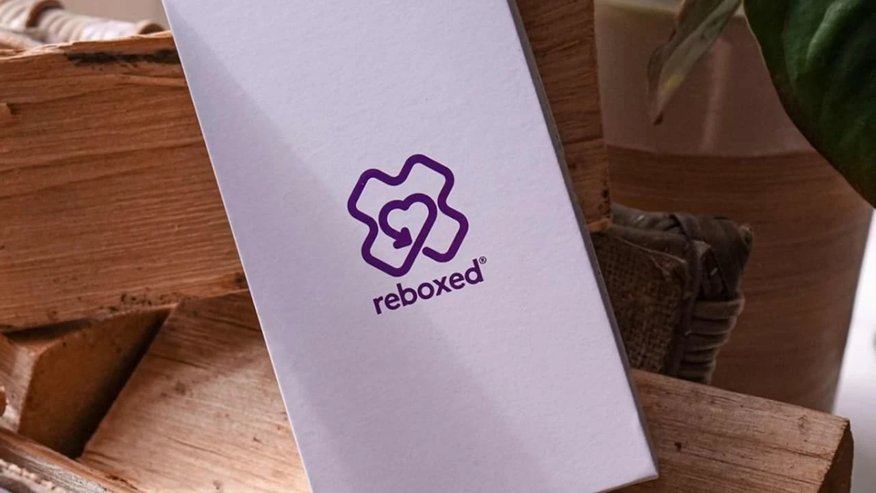 Close up on a plate of mashed potatoes, topped with baked pork chops with cream of mushroom soup, and a side of green beans.