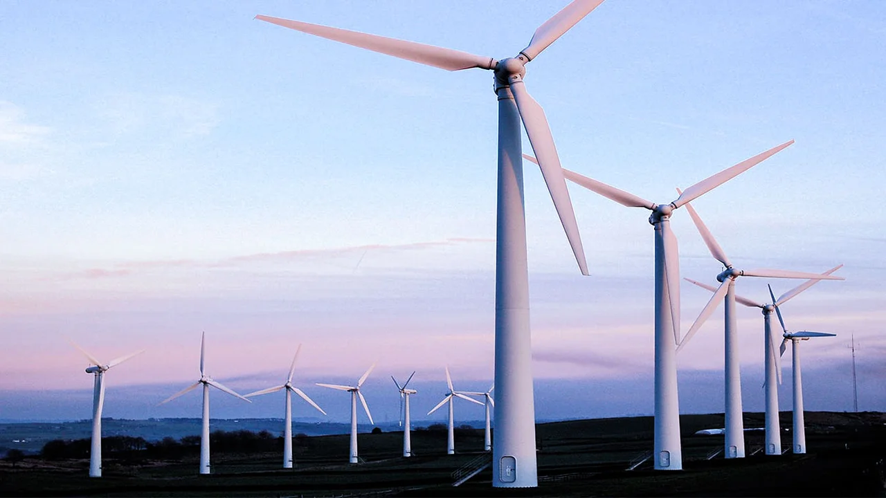 overhead view of corned beef sliced and on a platter with cabbage, potatoes, and carrots